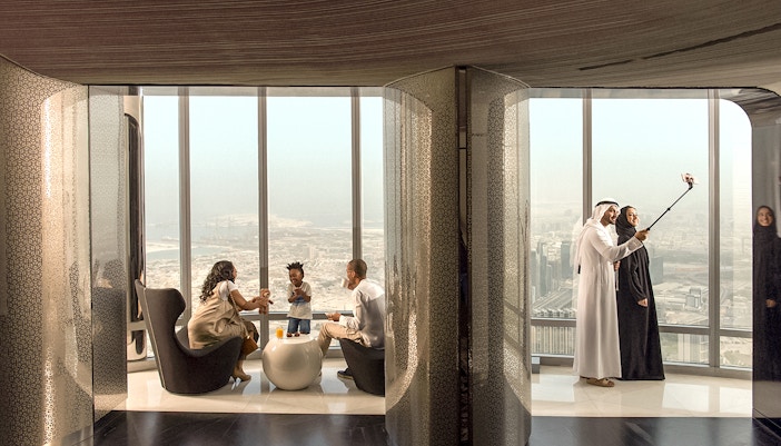 People enjoying refreshments and city view at the lounge, level 148, Burj Khalifa.