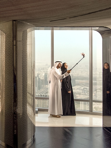 People enjoying refreshments and city view at the lounge, level 148, Burj Khalifa.