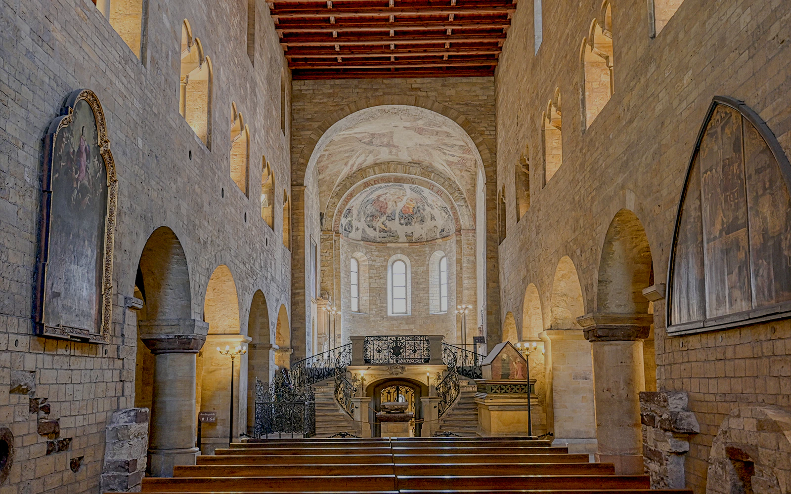 Interior of St. George’s Basilica with arches and frescoes, Prague Castle, Czech Republic.