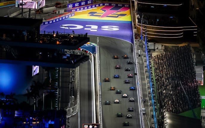 Formula 1 cars racing at night during the Jeddah Grand Prix 2026.