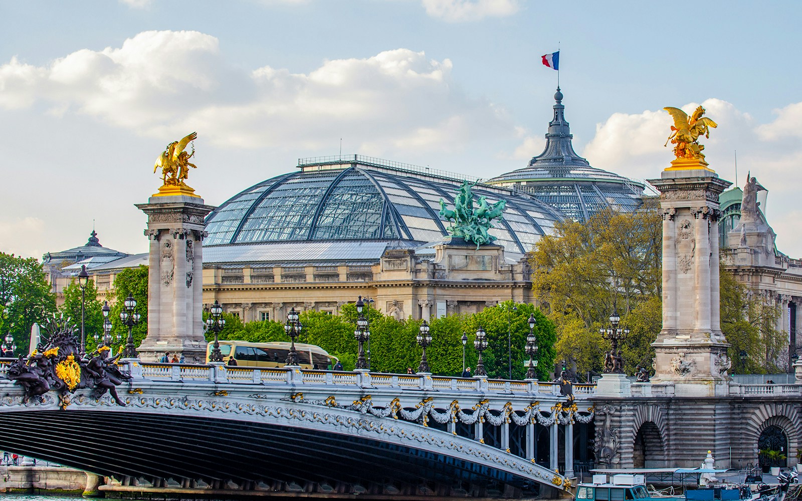 Eiffel Tower view with Grand Palais and Pont Alexandre III in Paris.