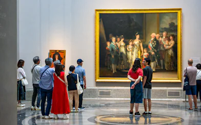 Visitors viewing paintings at the Prado Museum in Madrid.