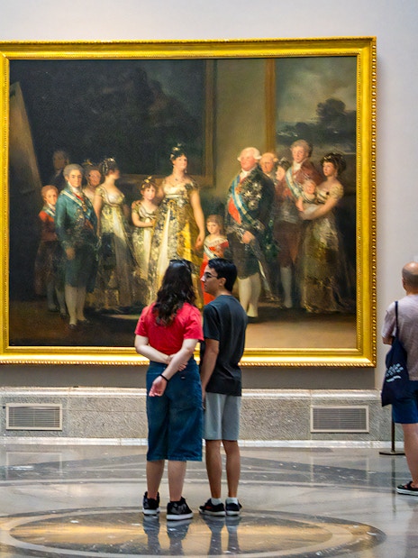 Visitors viewing paintings at the Prado Museum in Madrid.
