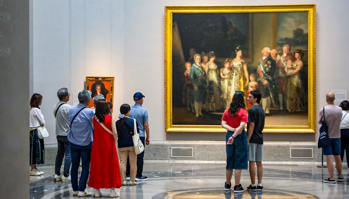 Visitors viewing paintings at the Prado Museum in Madrid, Spain.