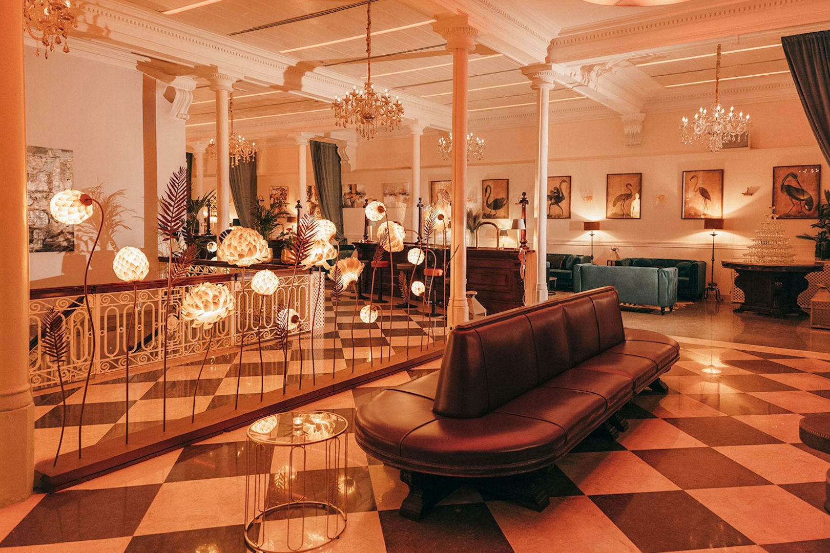 Elegant interior of a Barcelona venue with chandeliers and art, suitable for flamenco performances.