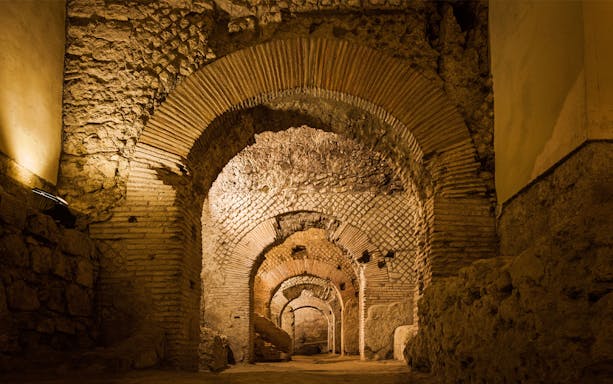 Underground arches and stone walls in Naples Underground, Italy.