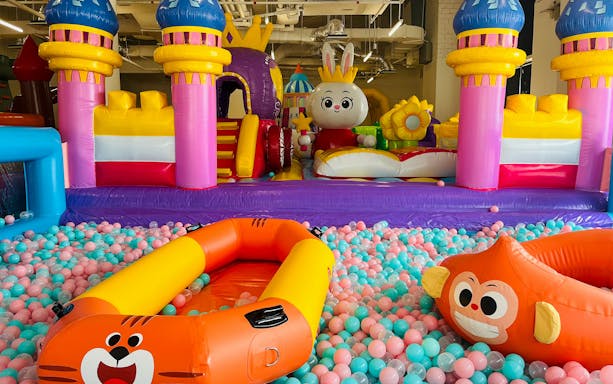 Inflatable playground with colorful castle and ball pit at Bouncetopia by Kiztopia, VivoCity.