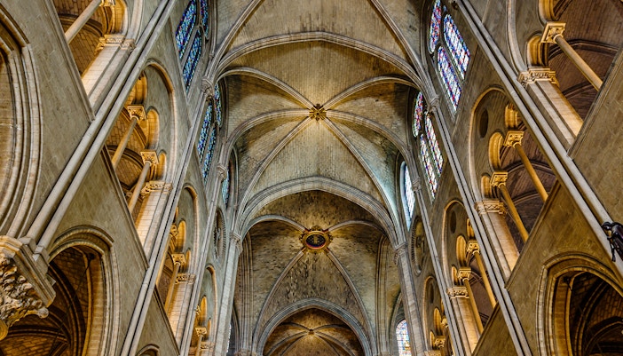Notre Dame Gallery interior with stained glass windows and vaulted ceilings, Paris, France.