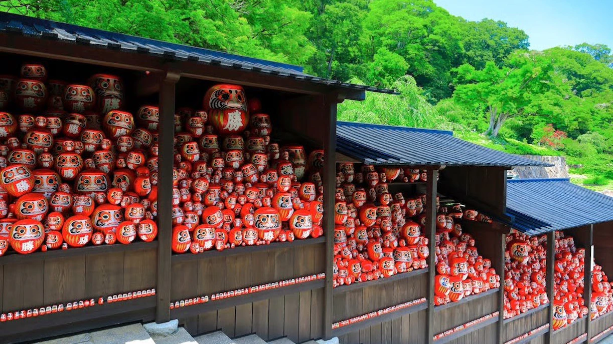 Kachi Daruma dolls on shelves at Katsuo-ji Temple, Japan.
