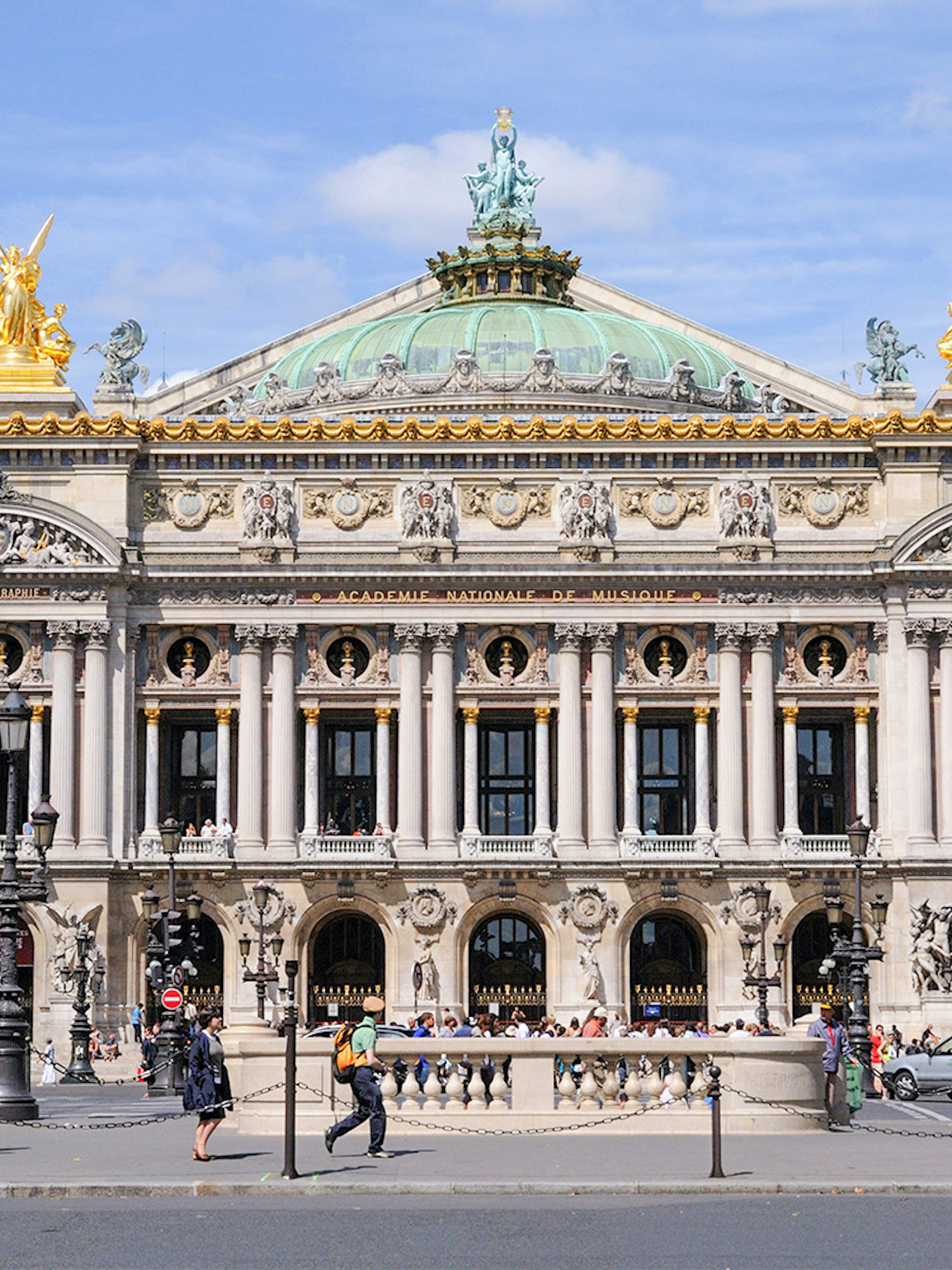 Opera Garnier facade in Paris with ornate architecture and golden statues.