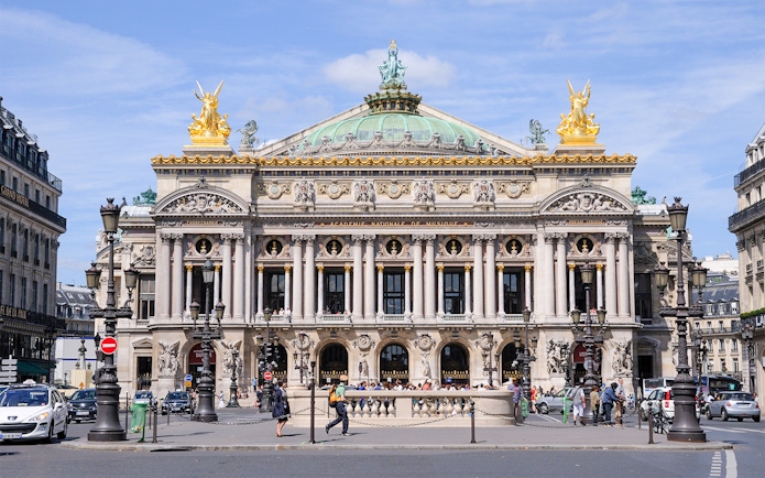Opera Garnier facade in Paris with ornate architecture and golden statues.