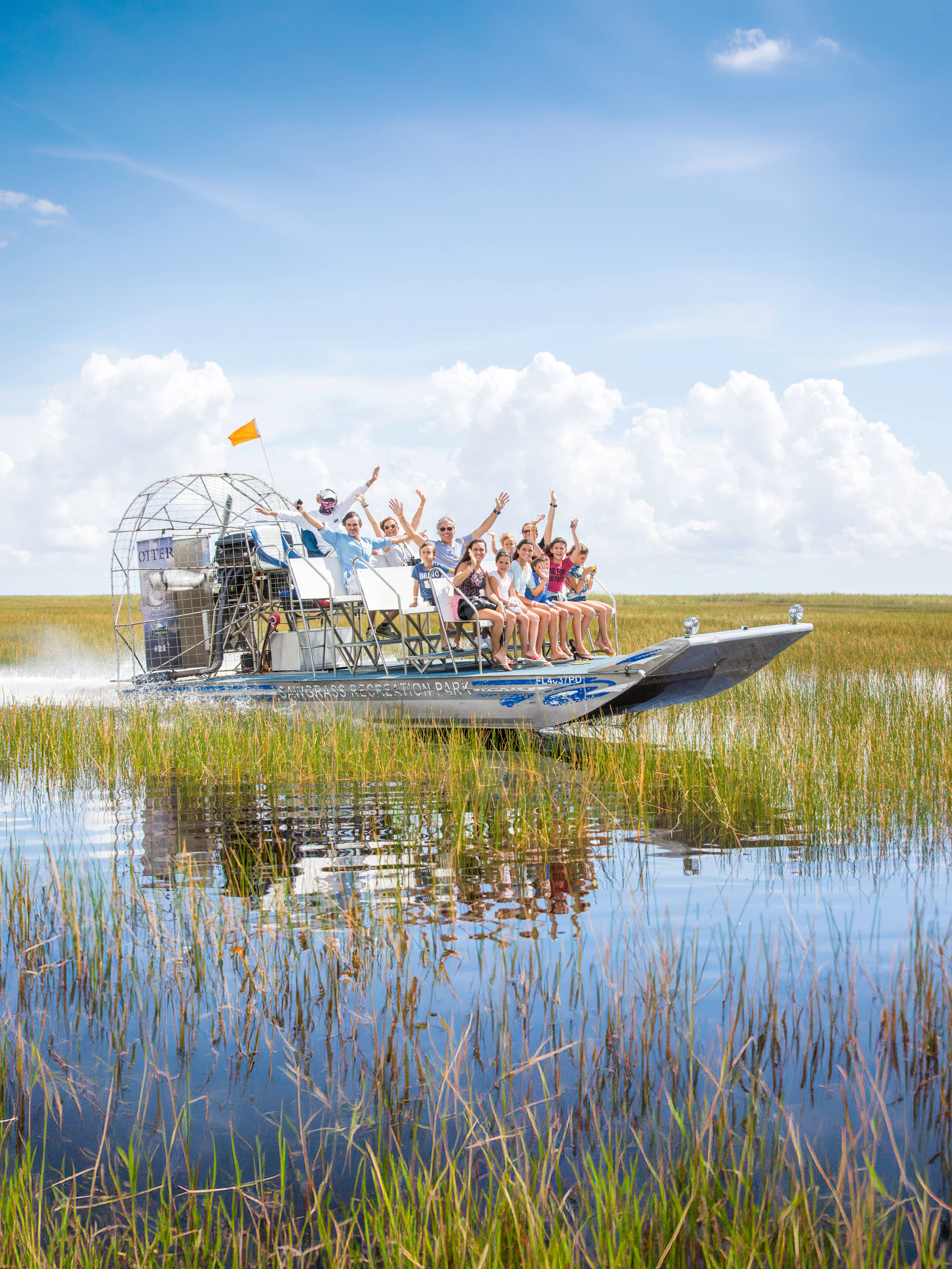 Guests enjoying an airboat ride through the Everglades, Miami.