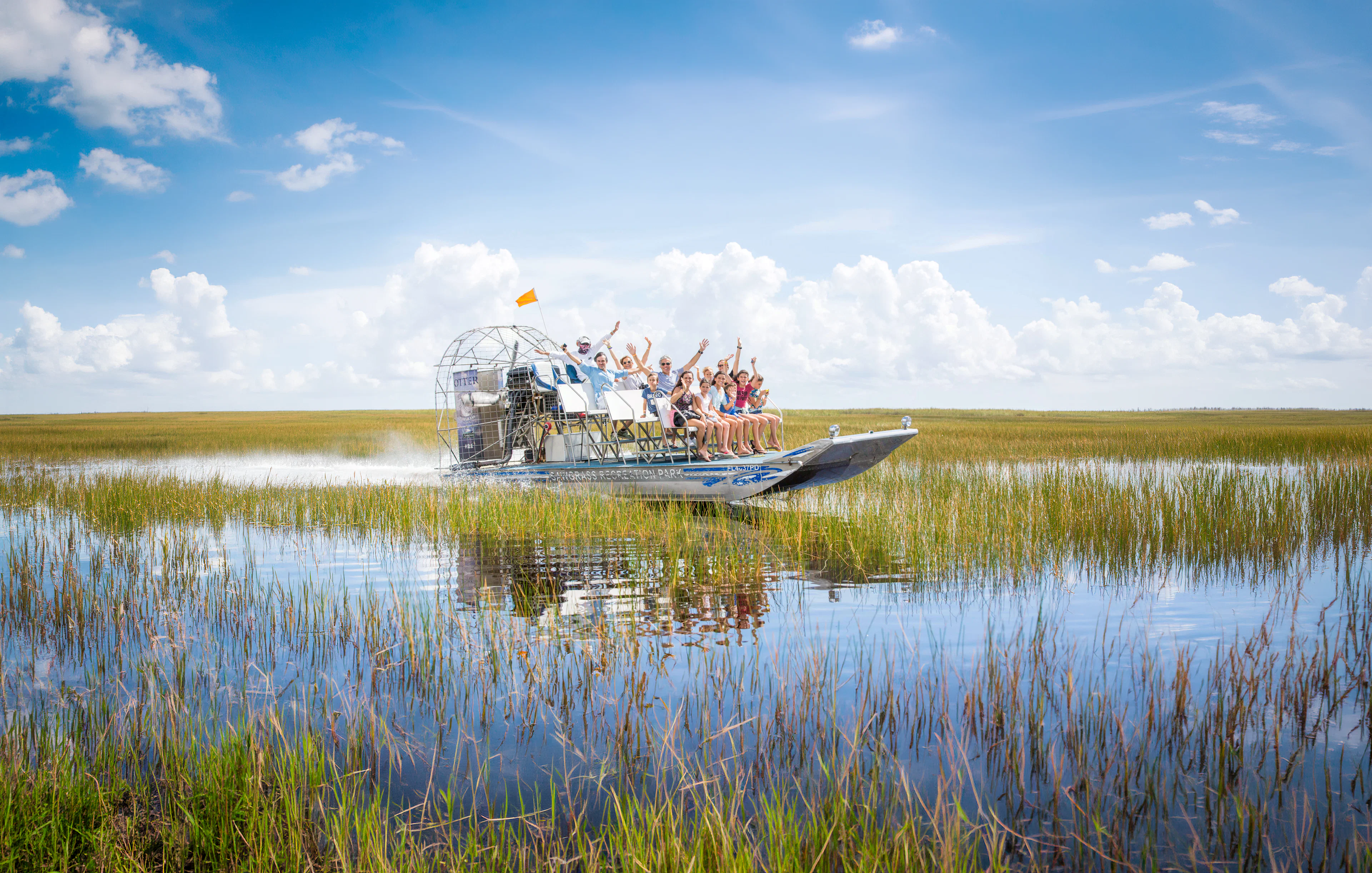 Guests enjoying an airboat ride through the Everglades, Miami.