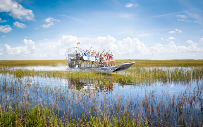 Guests enjoying an airboat ride through the Everglades, Miami.