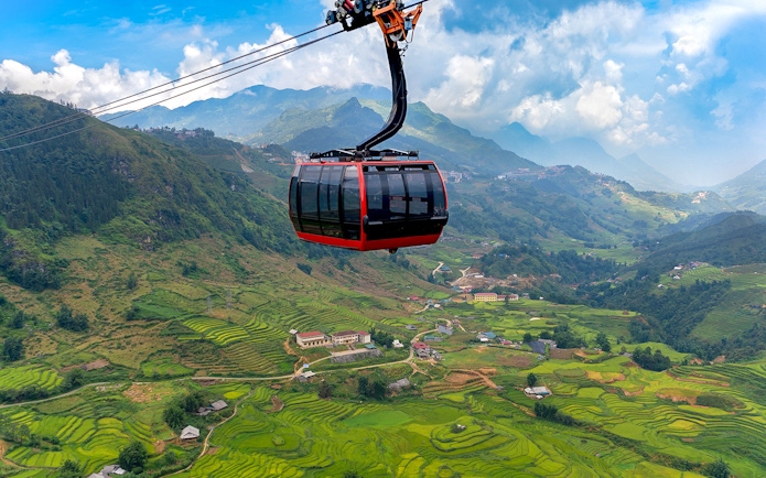 Cable car over terraced rice fields at Sun World Fansipan Legend, Vietnam.