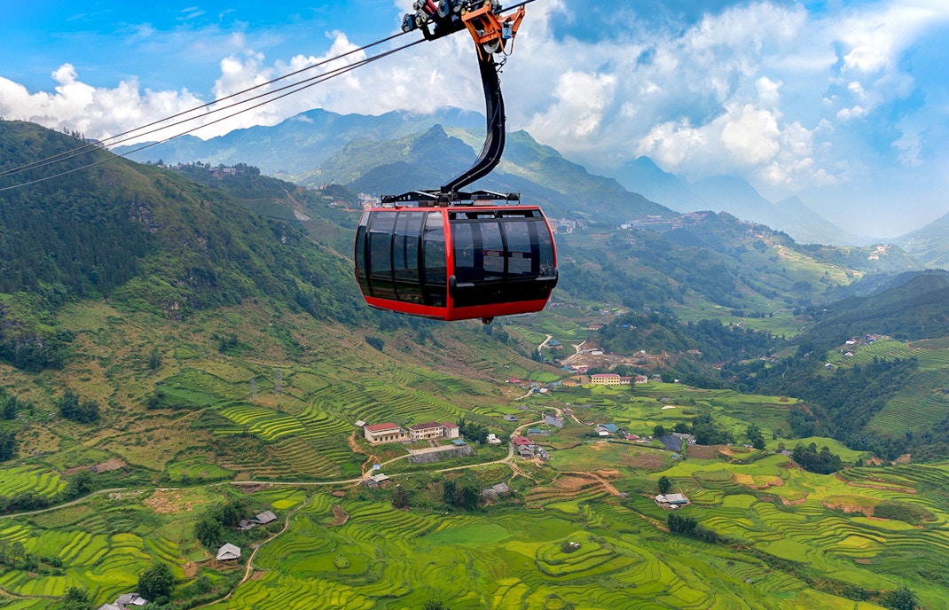 Cable car over terraced rice fields at Sun World Fansipan Legend, Vietnam.