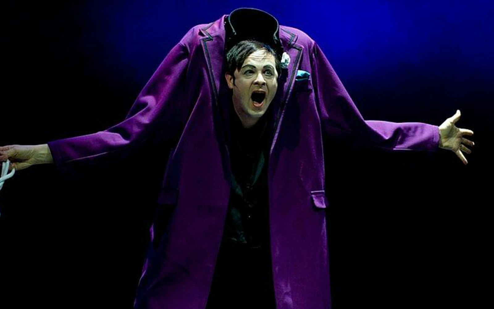 Performer in purple suit at Big Apple Circus Holiday Show.