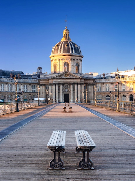 Pont des Arts bridge leading to Institut de France, Paris, featured in Emily in Paris tour.