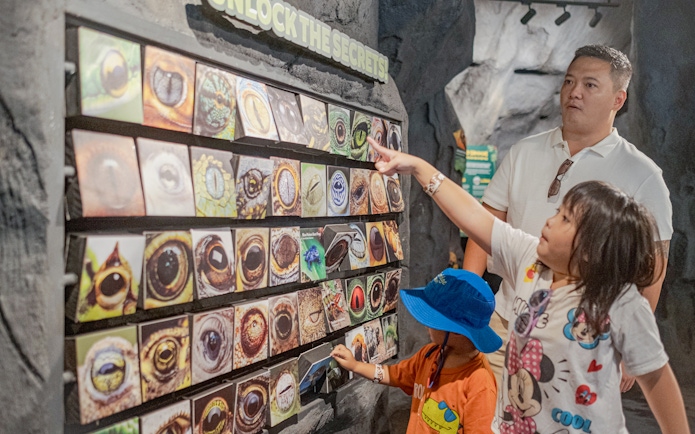 Children exploring animal eye displays at Marine Safari Bali.