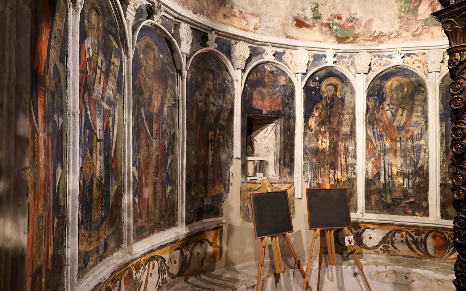Iconography inside Onufri National Iconographic Museum, Berat, featuring religious frescoes.