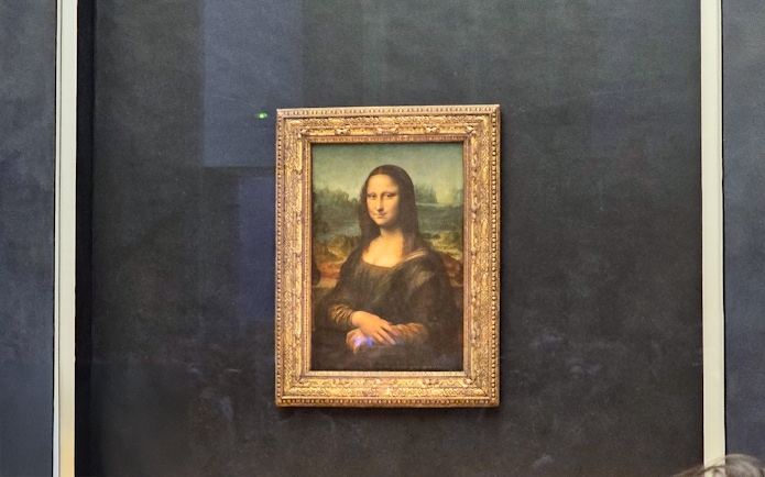 Mona Lisa painting at the Louvre Museum in Paris.