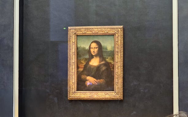 Mona Lisa painting at the Louvre Museum in Paris.