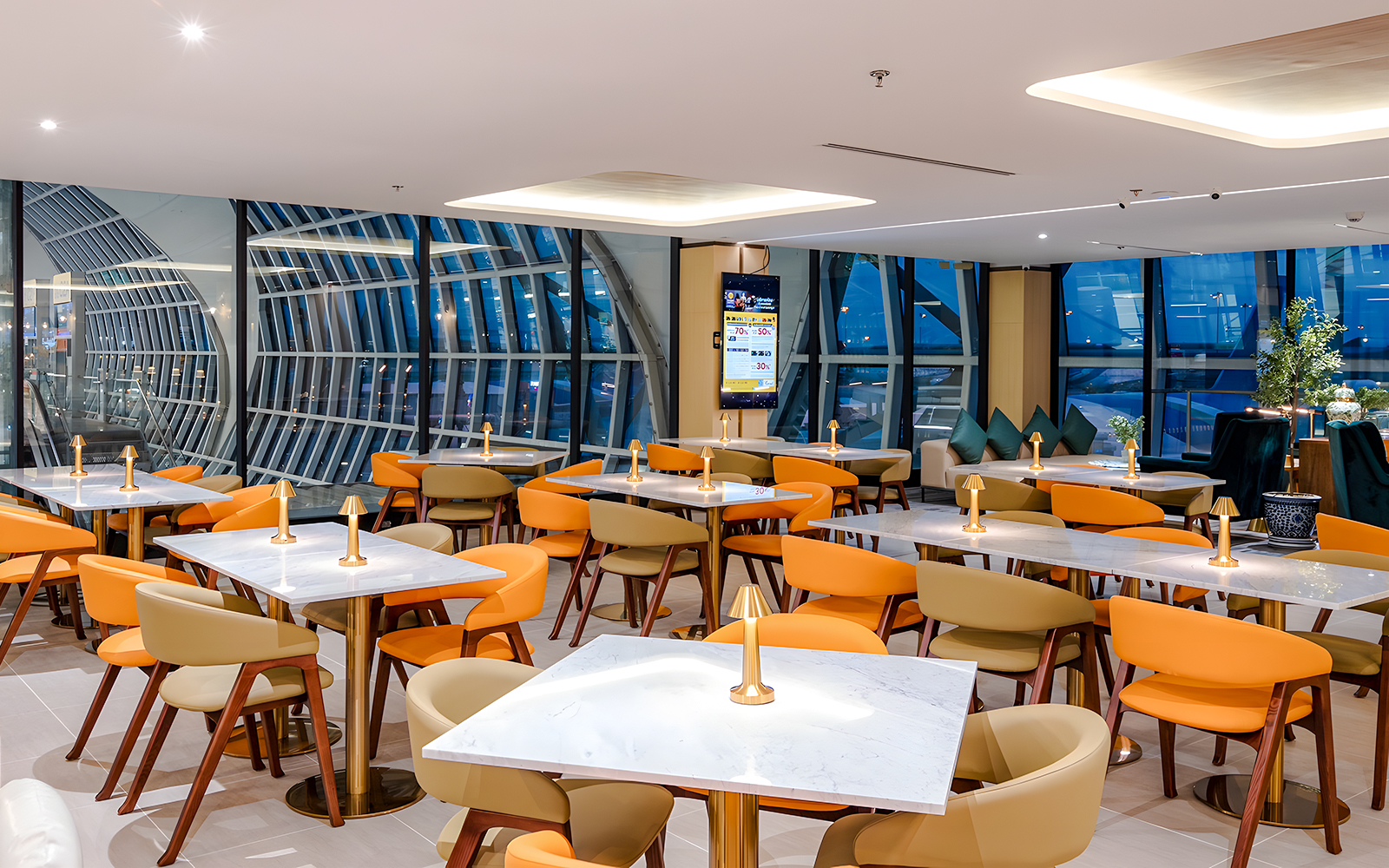 Coral Cosmo Lounge seating area with tables and chairs, Concourse C, Bangkok airport, Thailand.