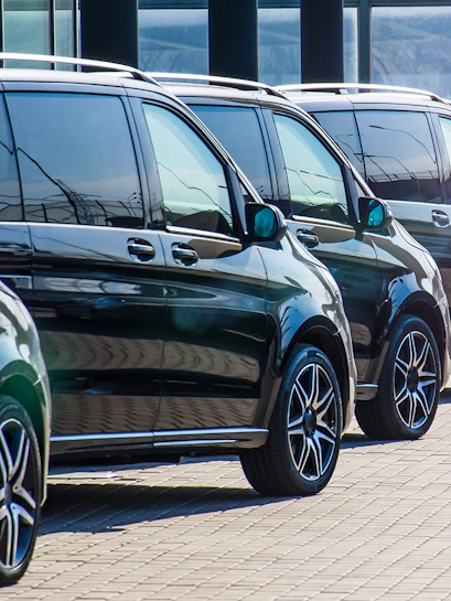 Minivans lined up for Athens airport transfer service.