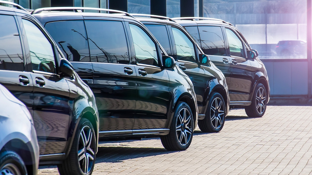 Minivans lined up for Athens airport transfer service.