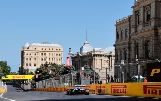 Formula 1 car racing on Baku city circuit during Azerbaijan Grand Prix 2026.