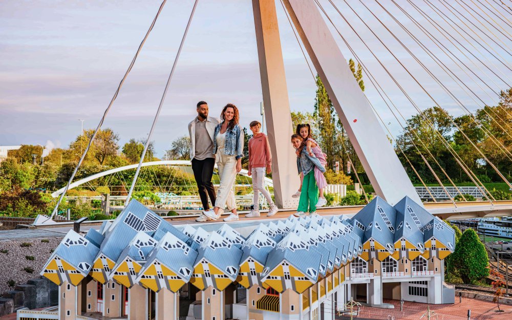 Visitors exploring miniature Dutch architecture at Madurodam park.