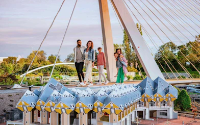 Visitors exploring miniature Dutch architecture at Madurodam park.