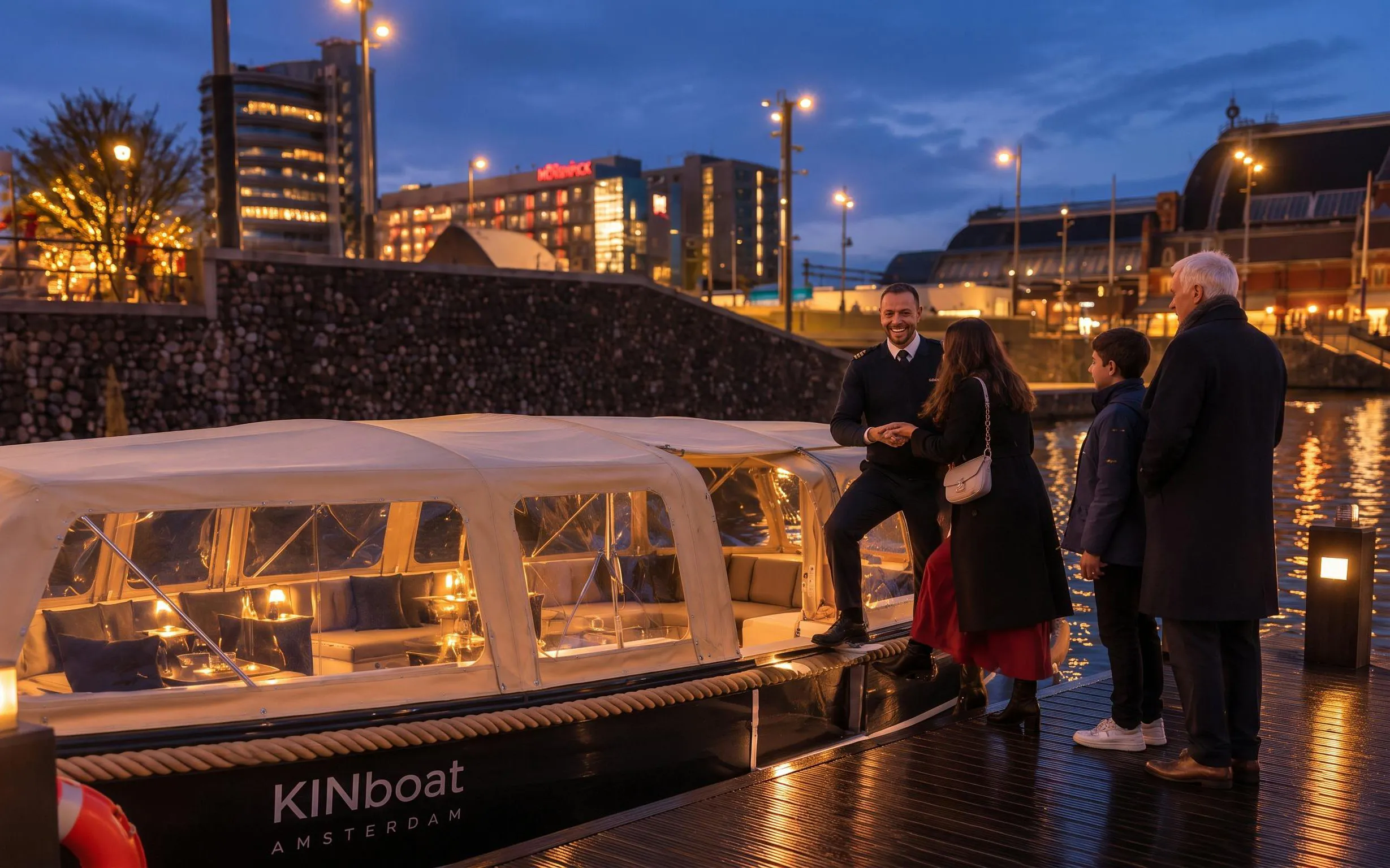 Boat tour at Amsterdam Light Festival with guide and visitors on illuminated canal.