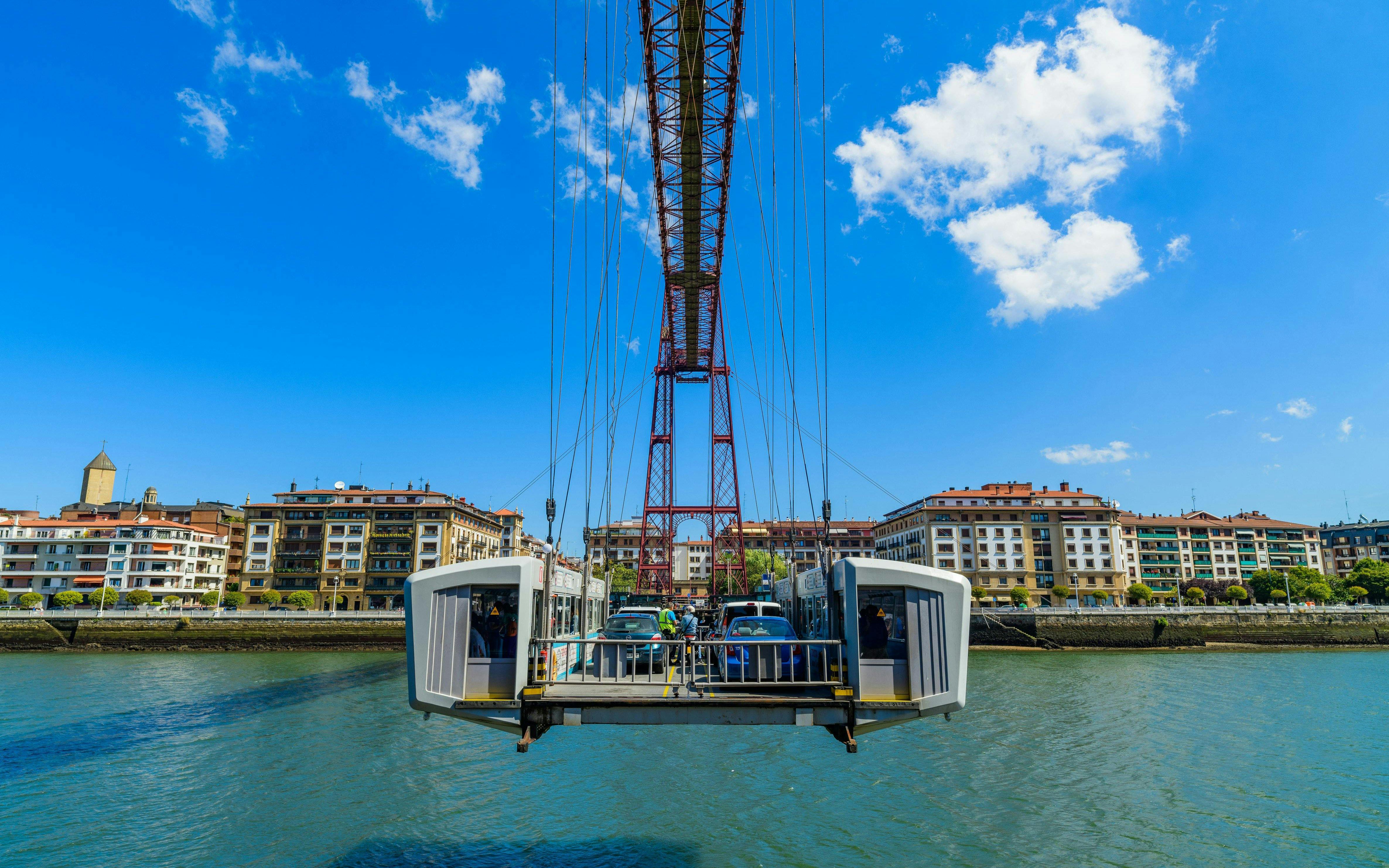Cars crossing the Biscay Bridge over the River Nervion in Portugalete, Spain.