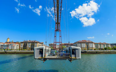 Cars crossing the Biscay Bridge over the River Nervion in Portugalete, Spain.
