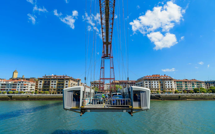 Cars crossing the Biscay Bridge over the River Nervion in Portugalete, Spain.