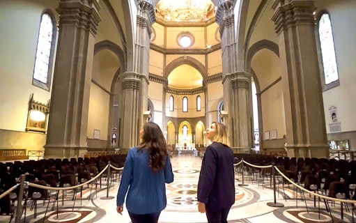 Visitors exploring the interior of Florence's Duomo during a guided tour.