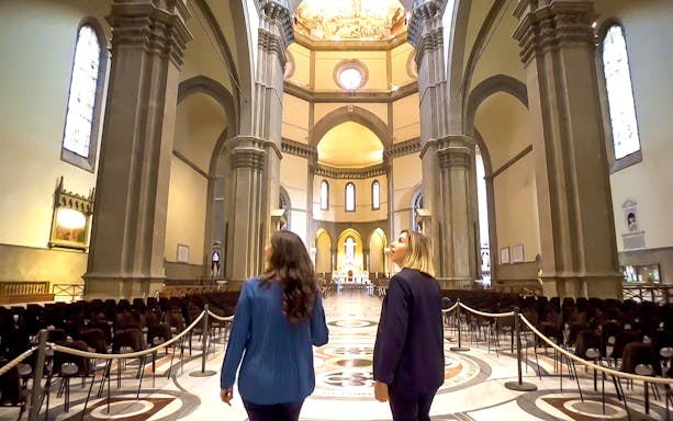 Visitors exploring the interior of Florence's Duomo during a guided tour.