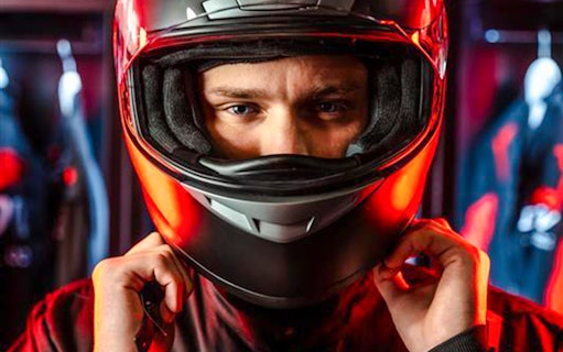 Guest preparing for F1 Experience in London with helmet on.