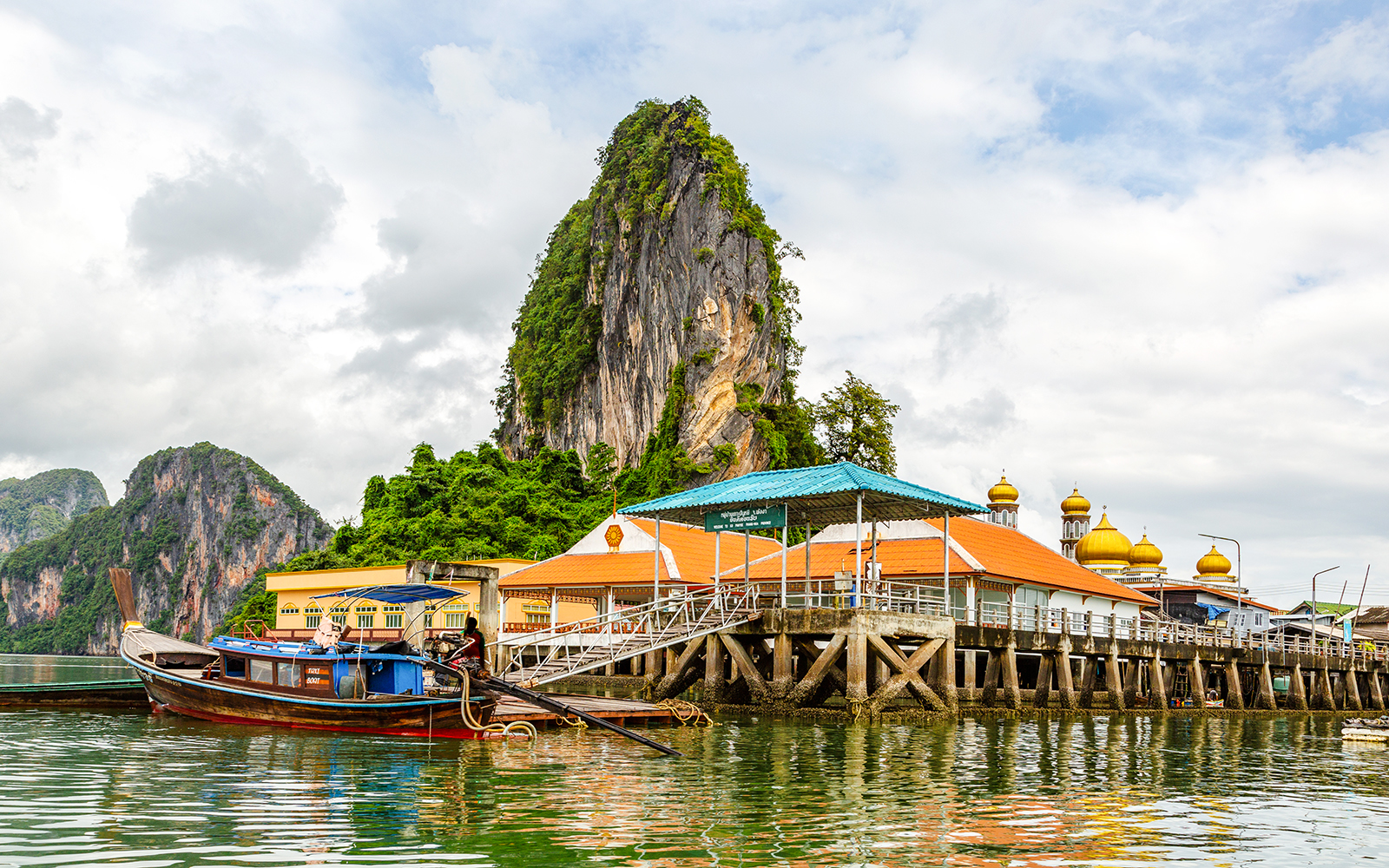 Koh Panyee floating village with limestone cliff and mosque, Thailand.