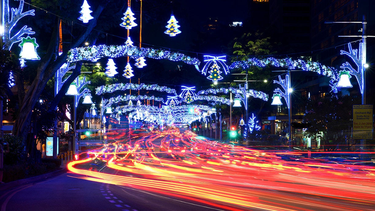 Orchard Road in Singapore illuminated with Christmas lights and festive decorations.