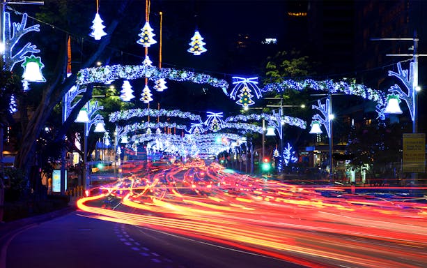 Orchard Road in Singapore illuminated with Christmas lights and festive decorations.
