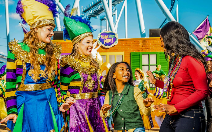 Participants enjoying a Mardi Gras celebration at Busch Gardens Williamsburg.