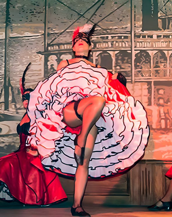 Performer in can-can dress dancing at Oasys Mini Hollywood, Spain.
