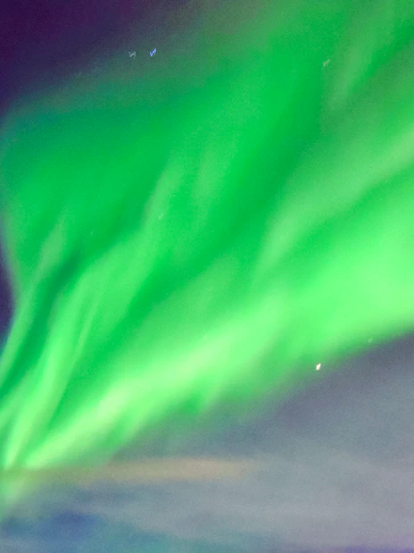 Northern lights display over a cruise ship in the Arctic.