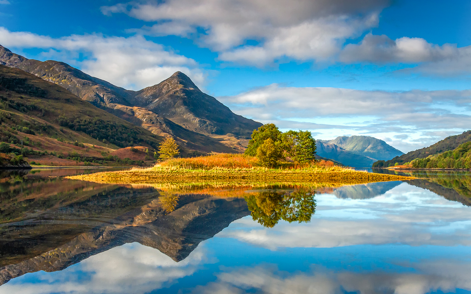 Scenic view of a mountain and lake reflection on the St Andrews & Fife tour from Edinburgh.