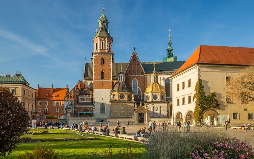 Wawel Cathedral exterior with tourists in Krakow, Poland.