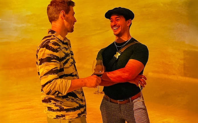 Visitors enjoying drinks at Frameless Lates event.