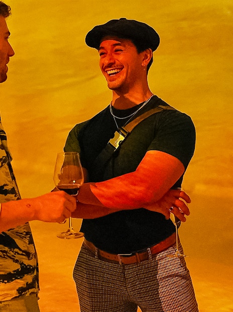 Visitors enjoying drinks at Frameless Lates event.