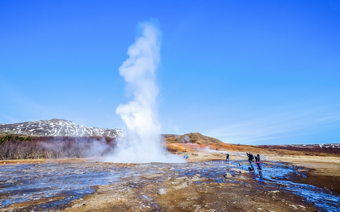Geyser erupting in Haukadalur Valley, part of Iceland's Golden Circle Tour.